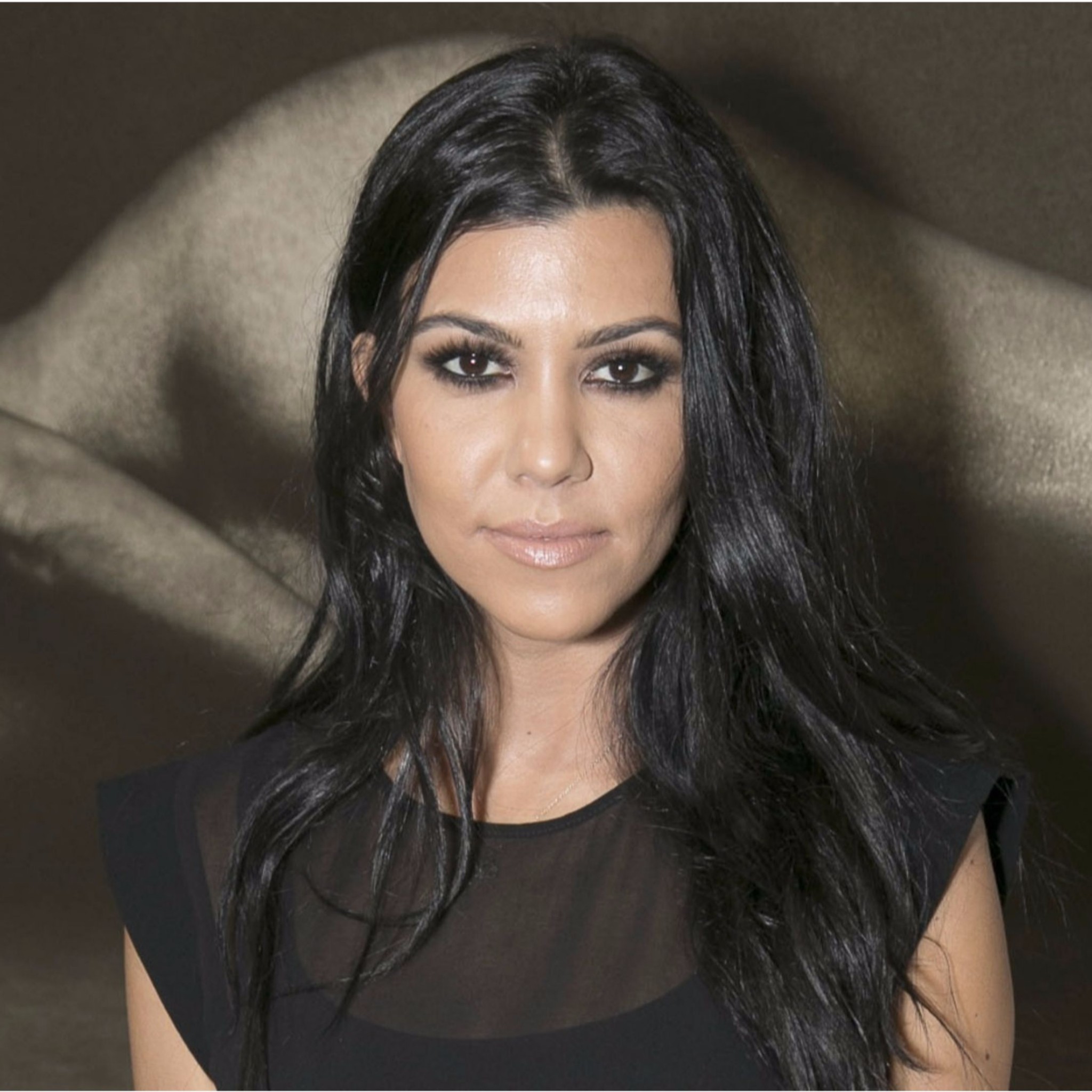 Kourtney Kardashian Wears Crop Top With Lace Bra