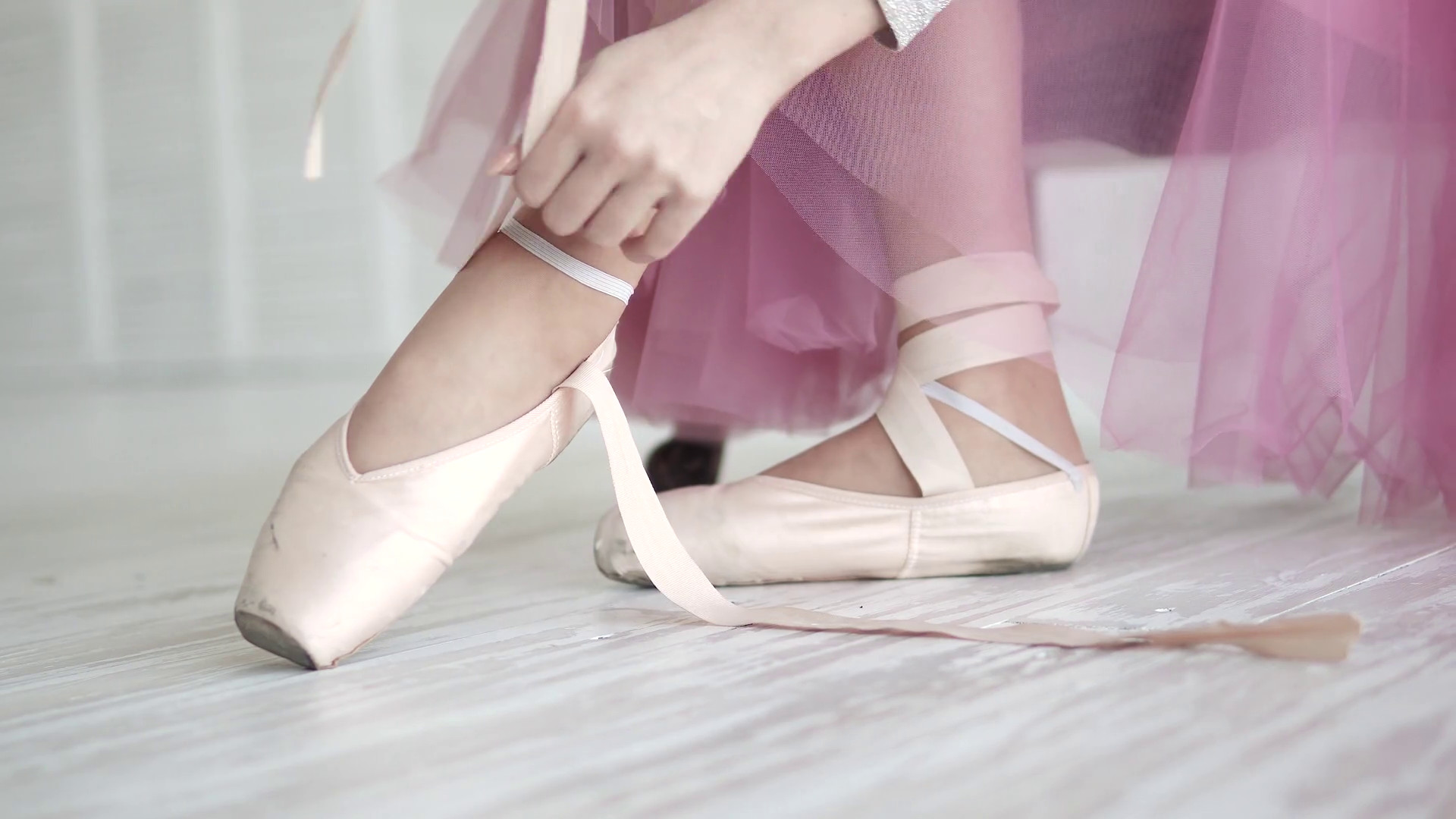 1920x1080 ballerina tying the pointes. ballet dancer wearing ballet shoes in the  studio Stock Video Footage - Storyblocks Video
