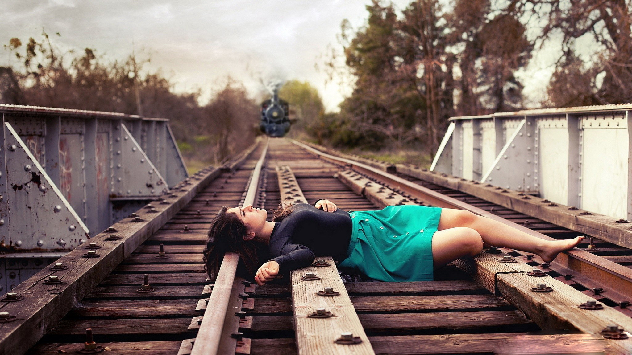 2048x1152 Sad Girl Lying on Railway Track