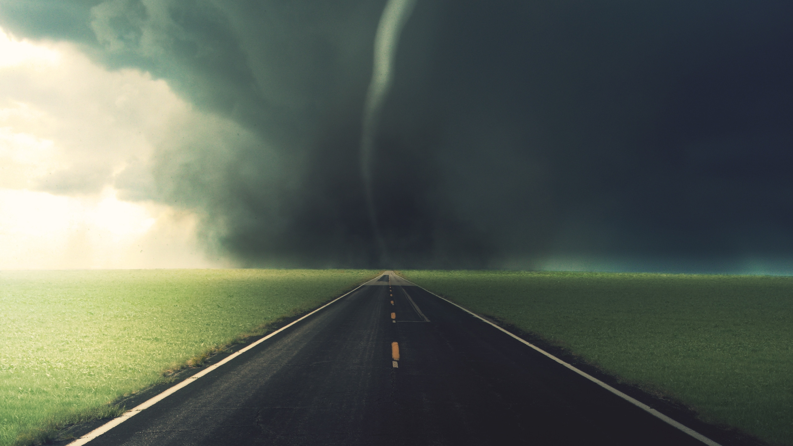 2560x1440 Preview wallpaper road, tornado, asphalt, marking, strip, blackness, clouds  