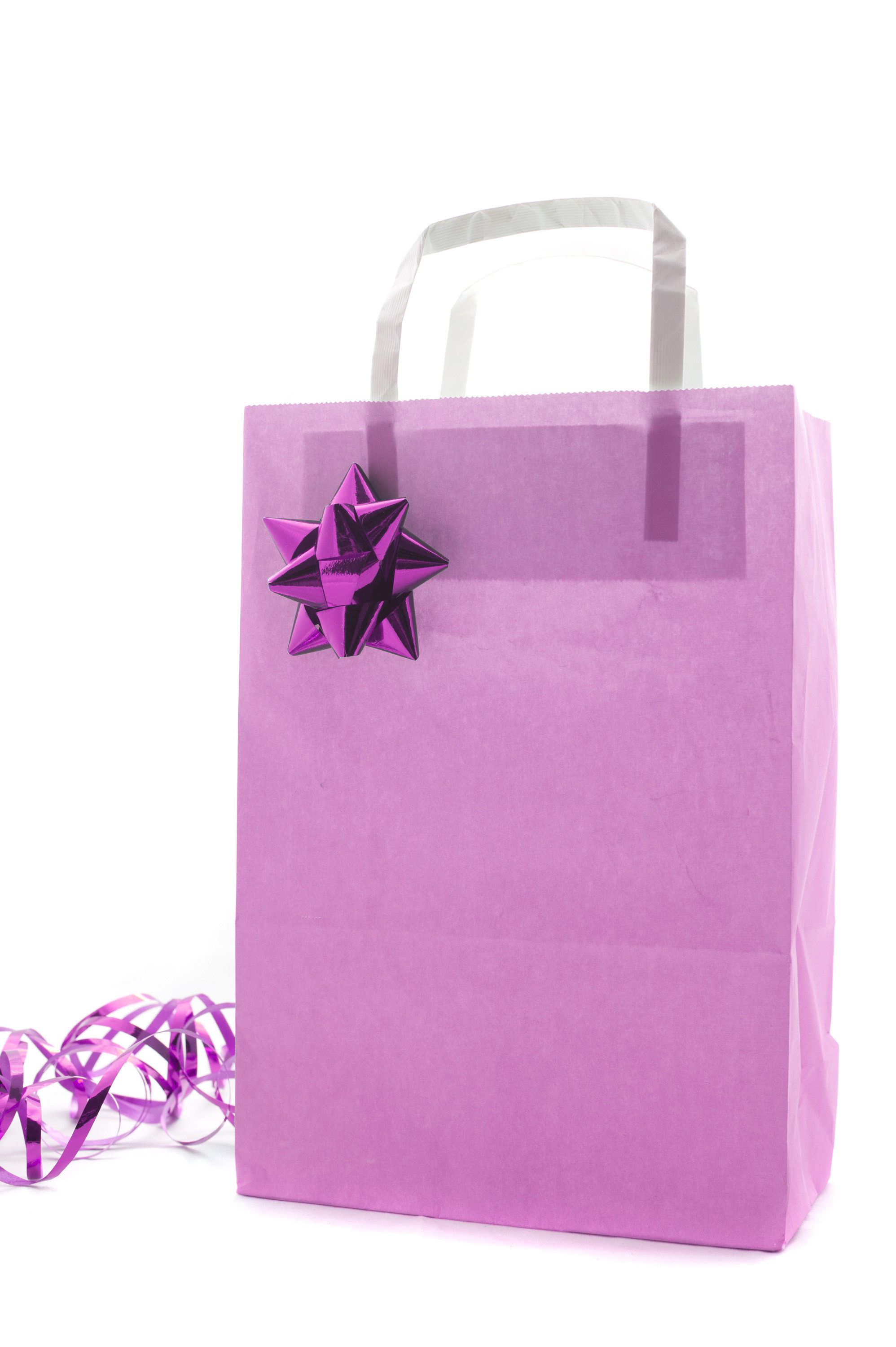 1996x3000 Pink Christmas shopping or gift bag decorated with a metallic bow and  twirled ribbon isolated on