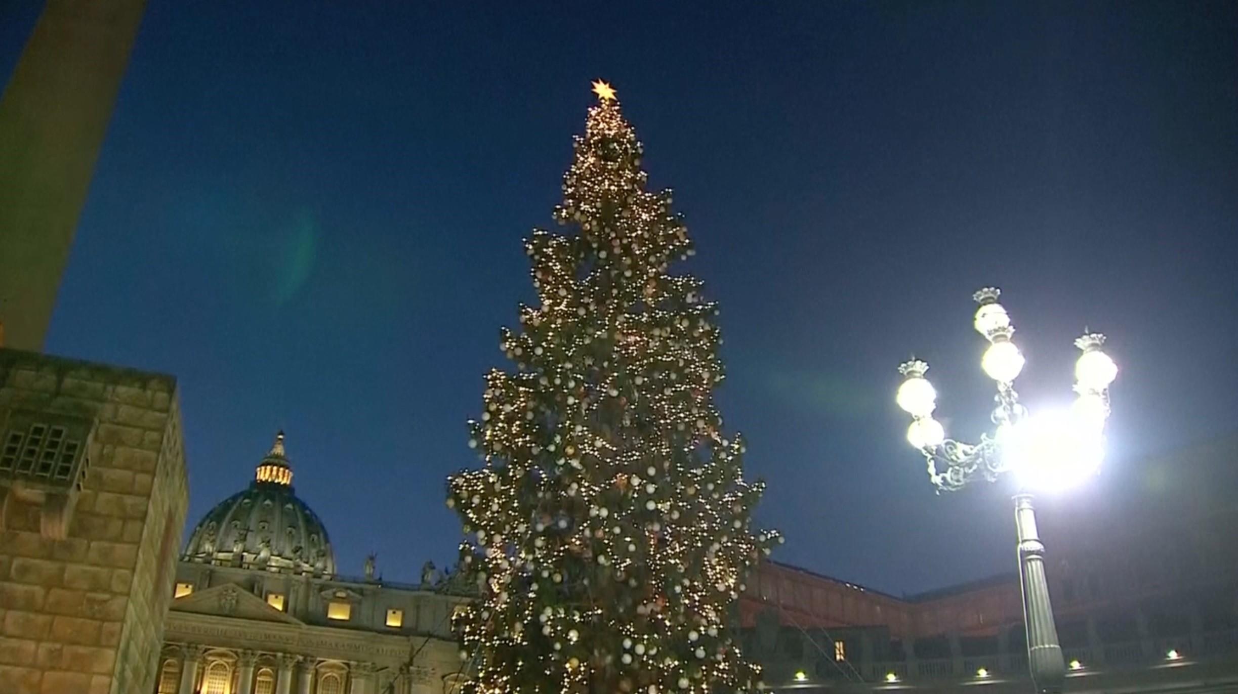 2446x1372 Vatican Christmas tree is lit in St. Peter's Square, adorned with ornaments  made from sick children across Italy and the nativity scene includes a  spire ...