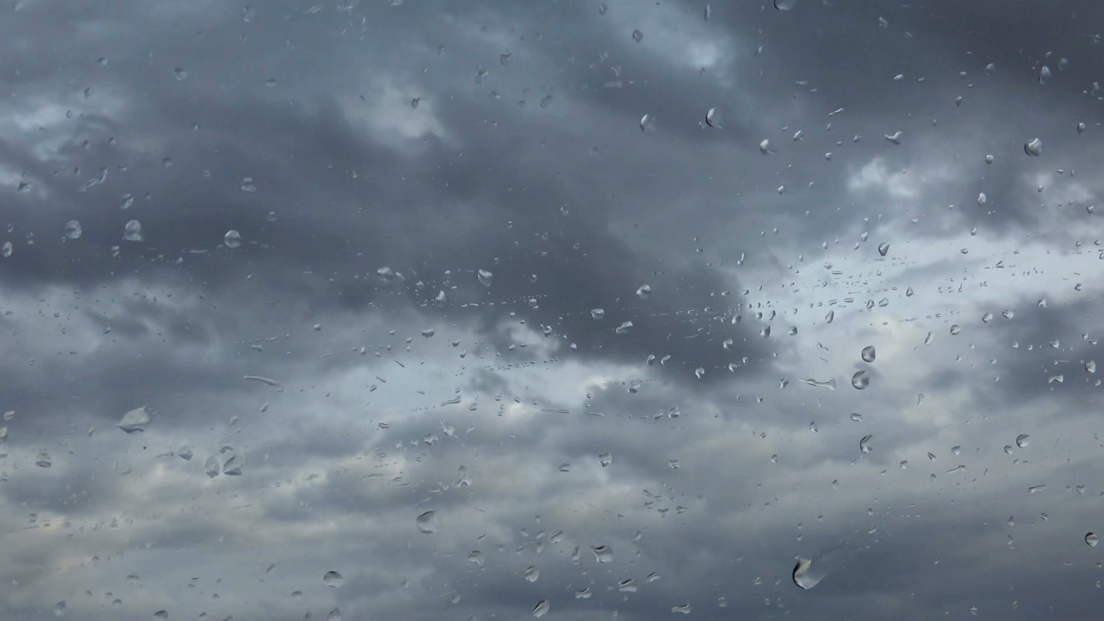3840x2160 Rainy Days, Rain Drops on Window Pane of a Car in Motion, Bad Weather  Background. Stock Video Footage - VideoBlocks