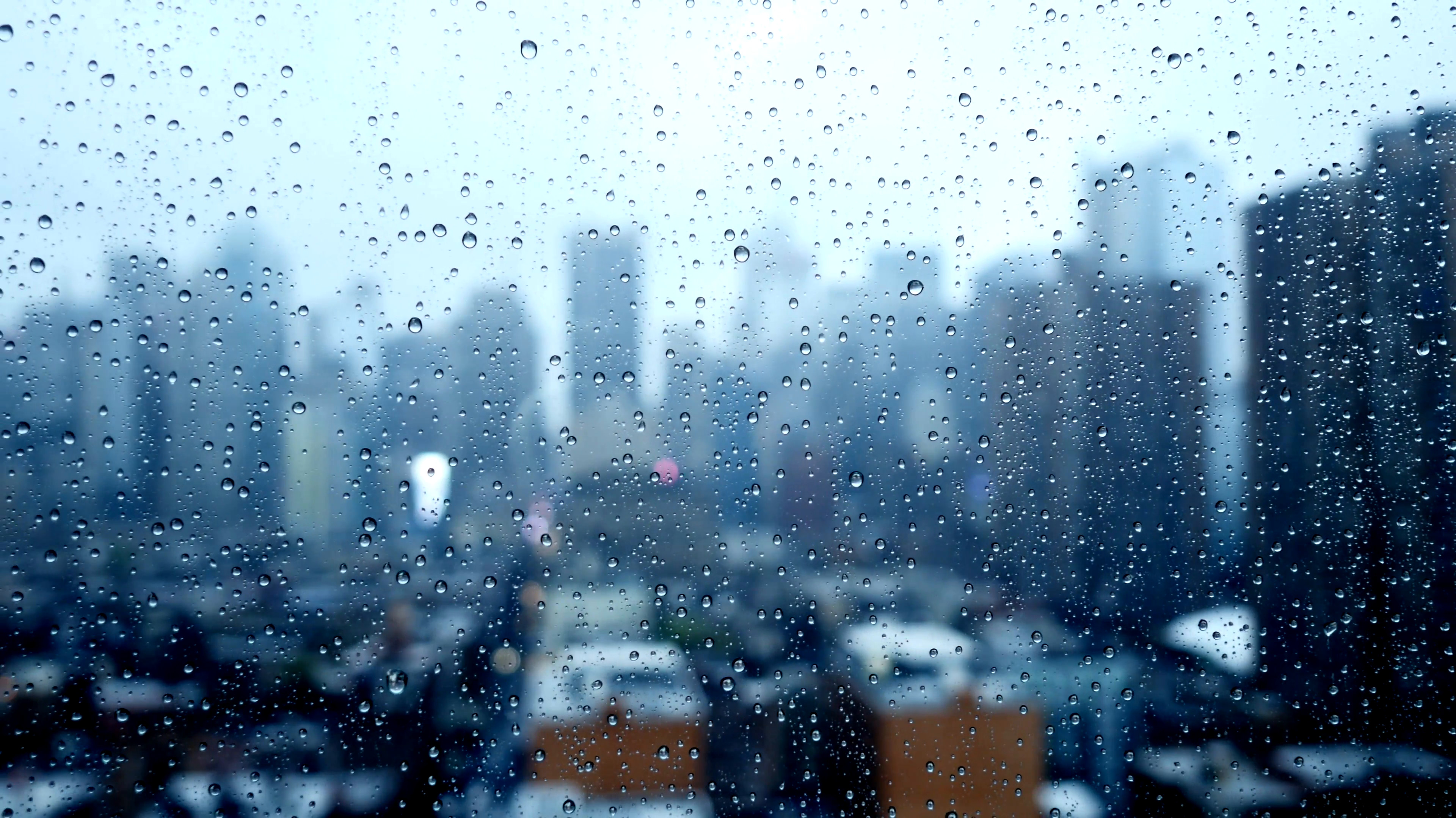 3840x2160 city skyline background on a rainy wet weather day. sad mood depressive
