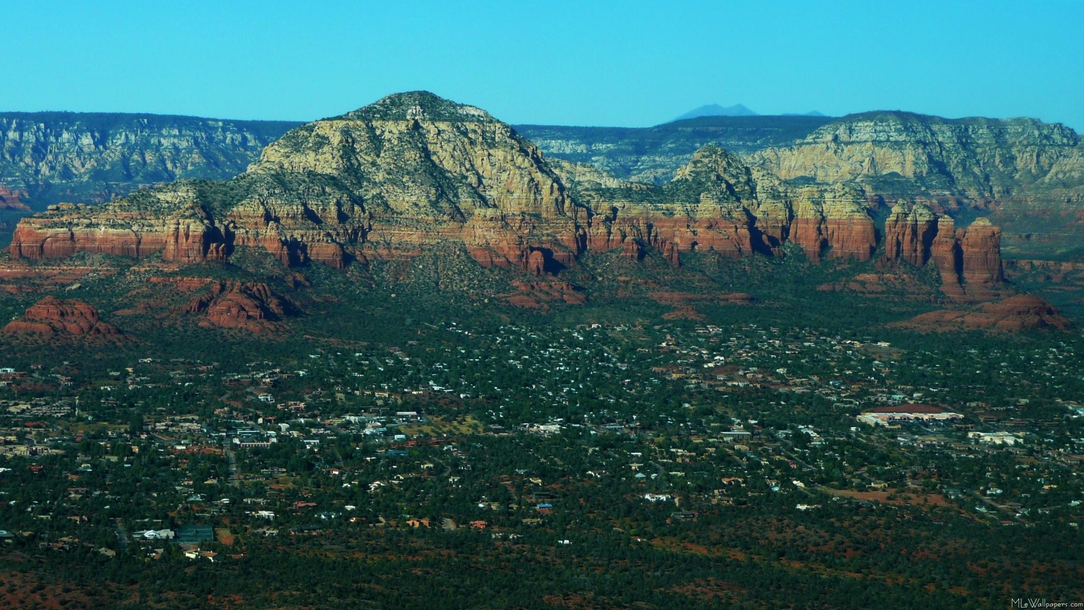 2132x1200 We were fortunate enough to not only tour in Sedona, Arizona, but also  above it. Here is a wallpaper showing the view over Sedona including the  famous ...
