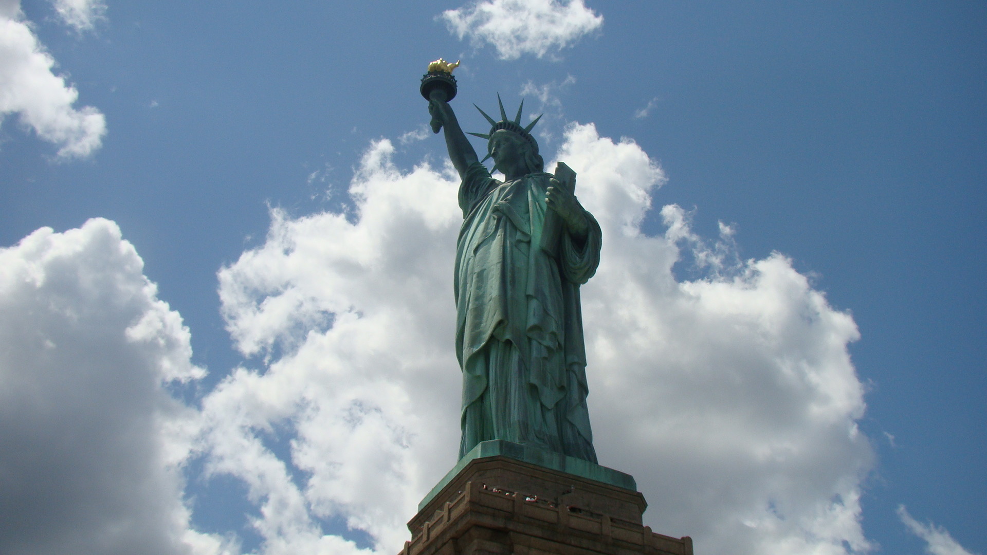 1920x1080 Sky Touching Statue Of Liberty Wallpaper
