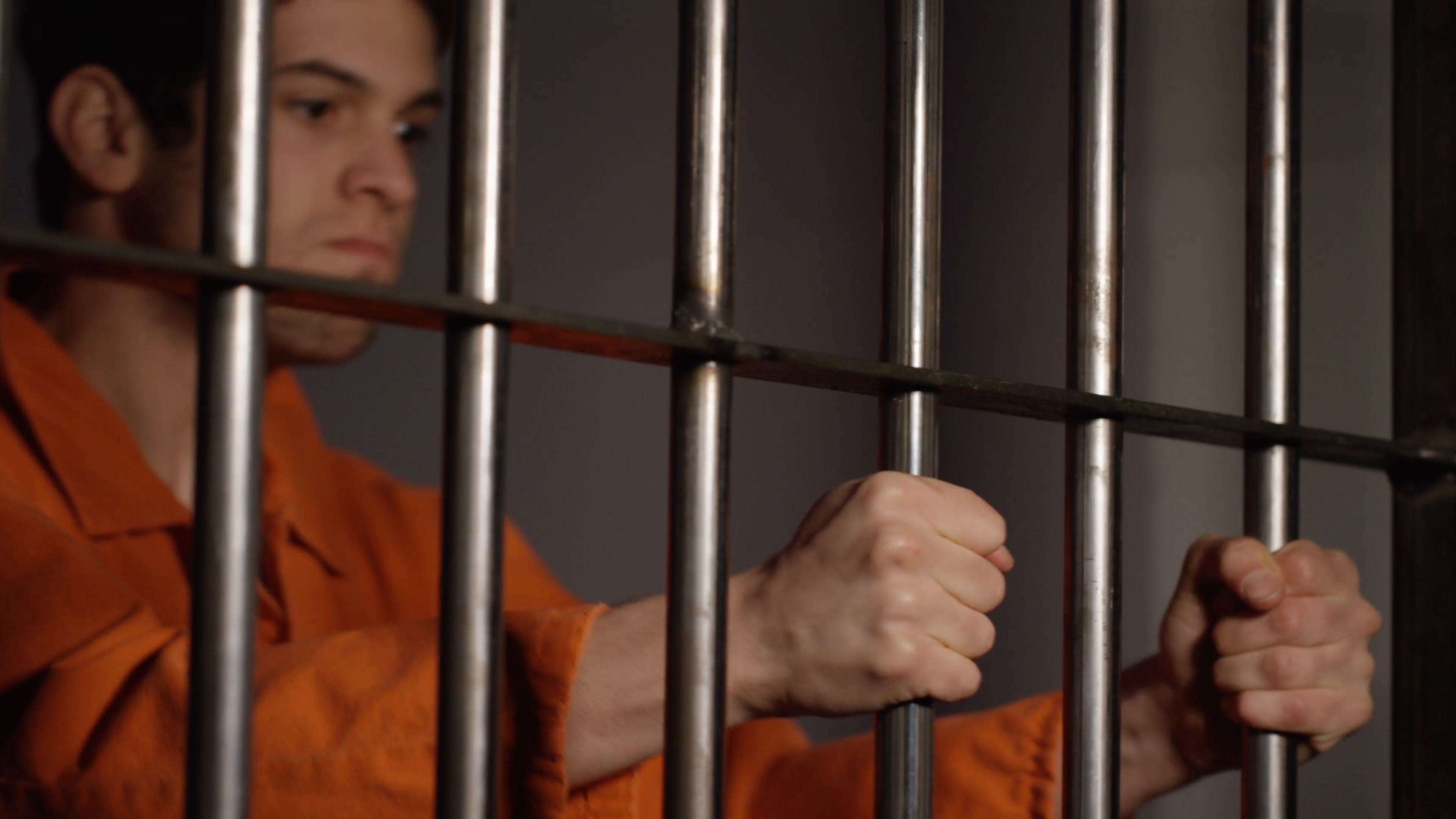 3840x2160 Prison cells in Jail - Man in orange jumpsuit - inmate behind bars Stock  Video Footage - VideoBlocks