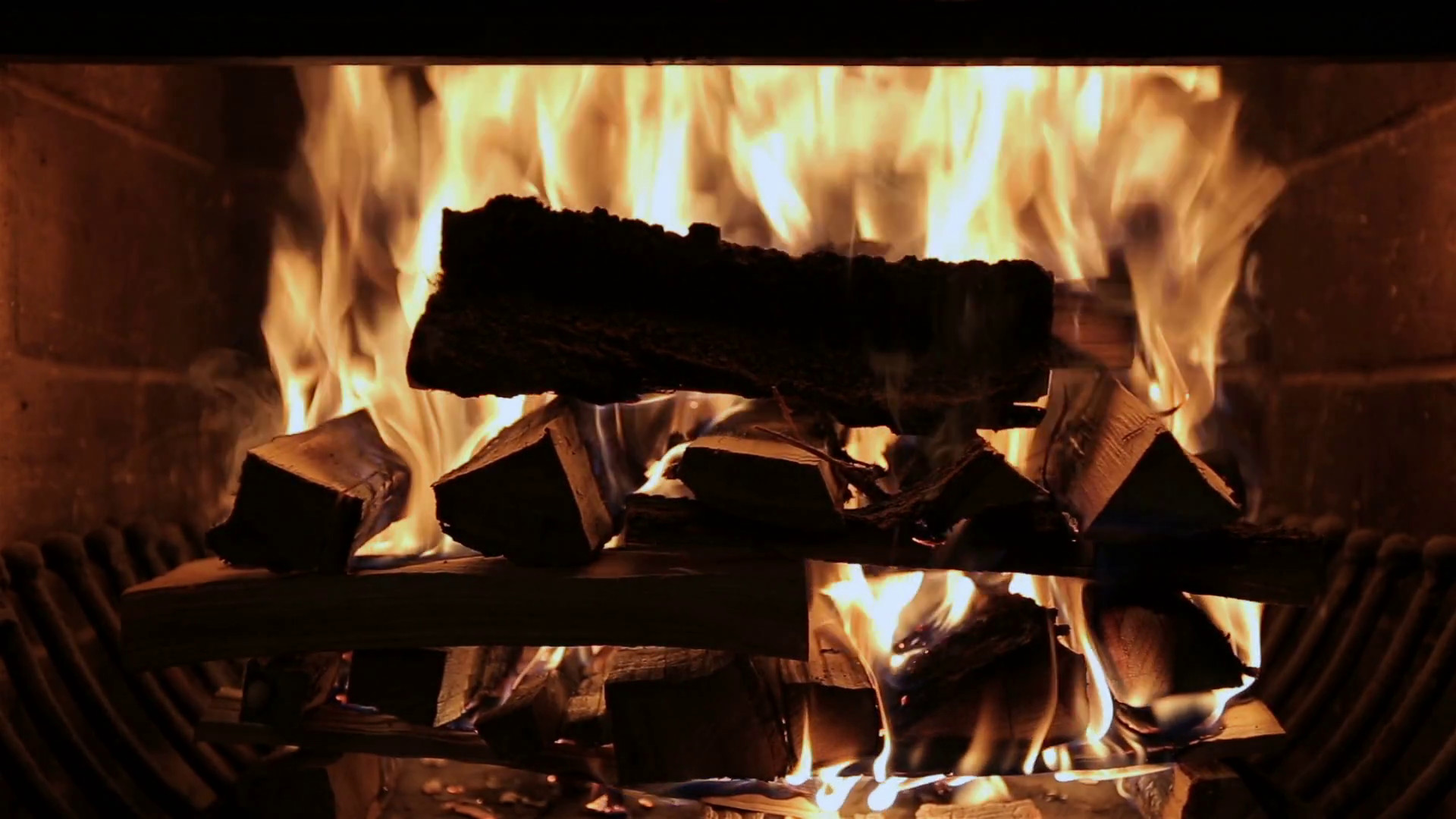 1920x1080 Fireplace burning. Warm cozy burning fire in a brick fireplace close up.  Cozy background. Stock Video Footage - VideoBlocks