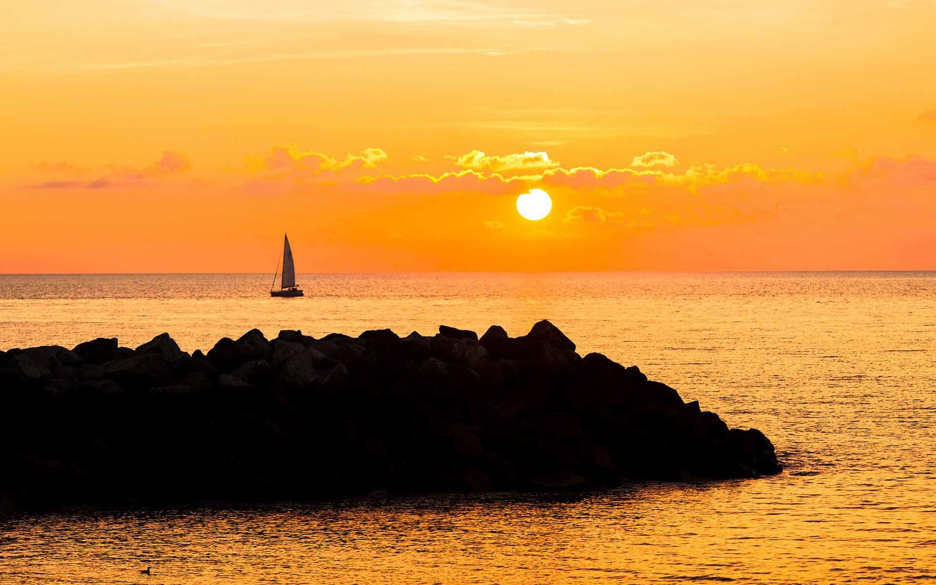1920x1200 Sunrise Sunset Sailing Rock Sky Boats Sail Ocean Vehicles Sea Clouds Mood  Nature View Wallpaper Free Download