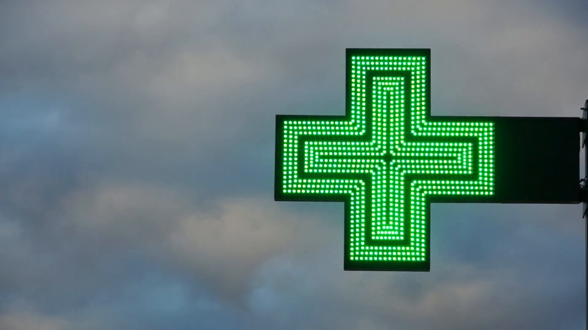 1920x1080 Green cross blinking on cloudy background at dusk. Stock Video Footage -  VideoBlocks