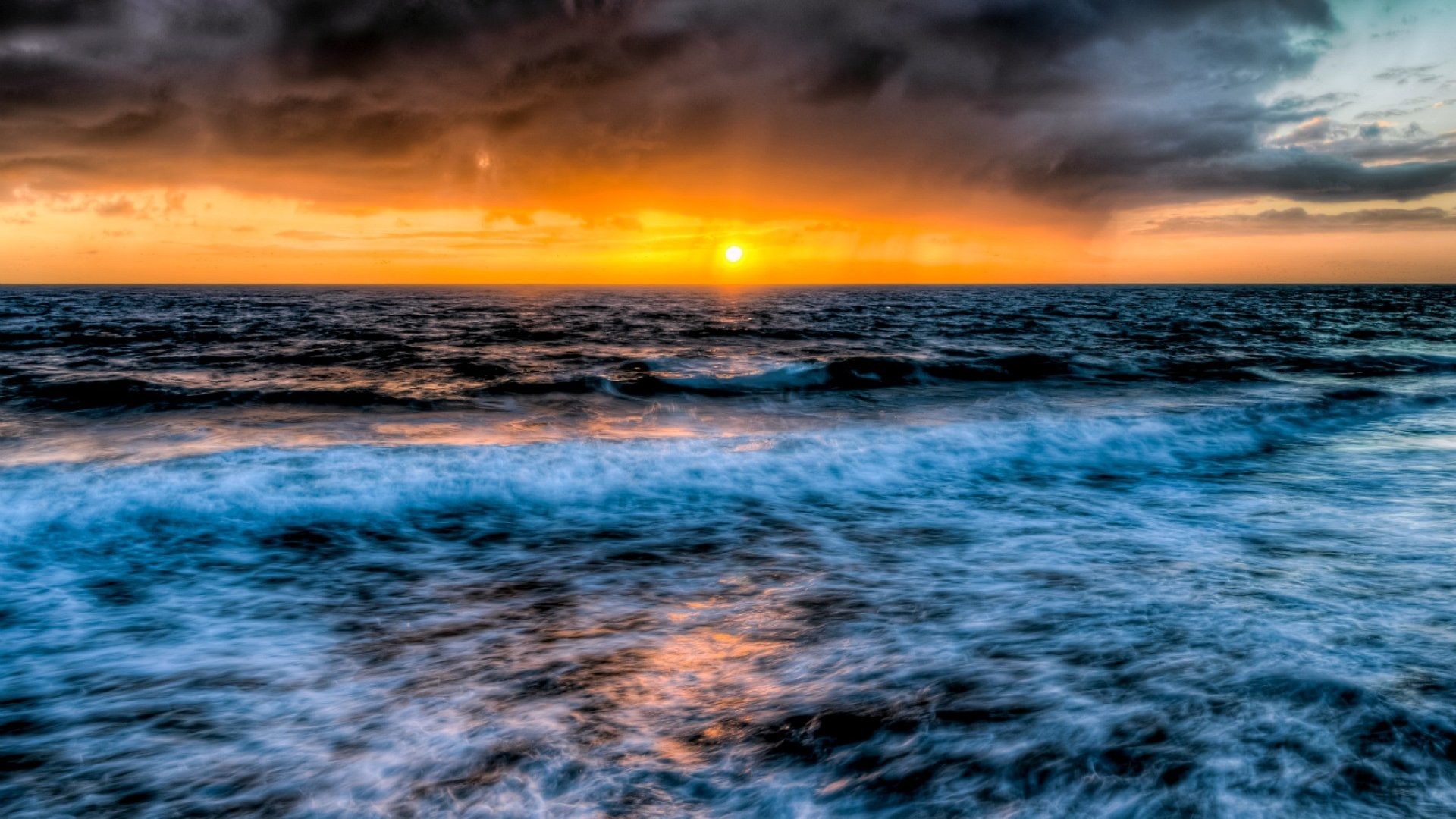 1920x1080 Stormy Skies Sunset Ocean Waves Reflection 1080p Wallpaper - 1920x1200