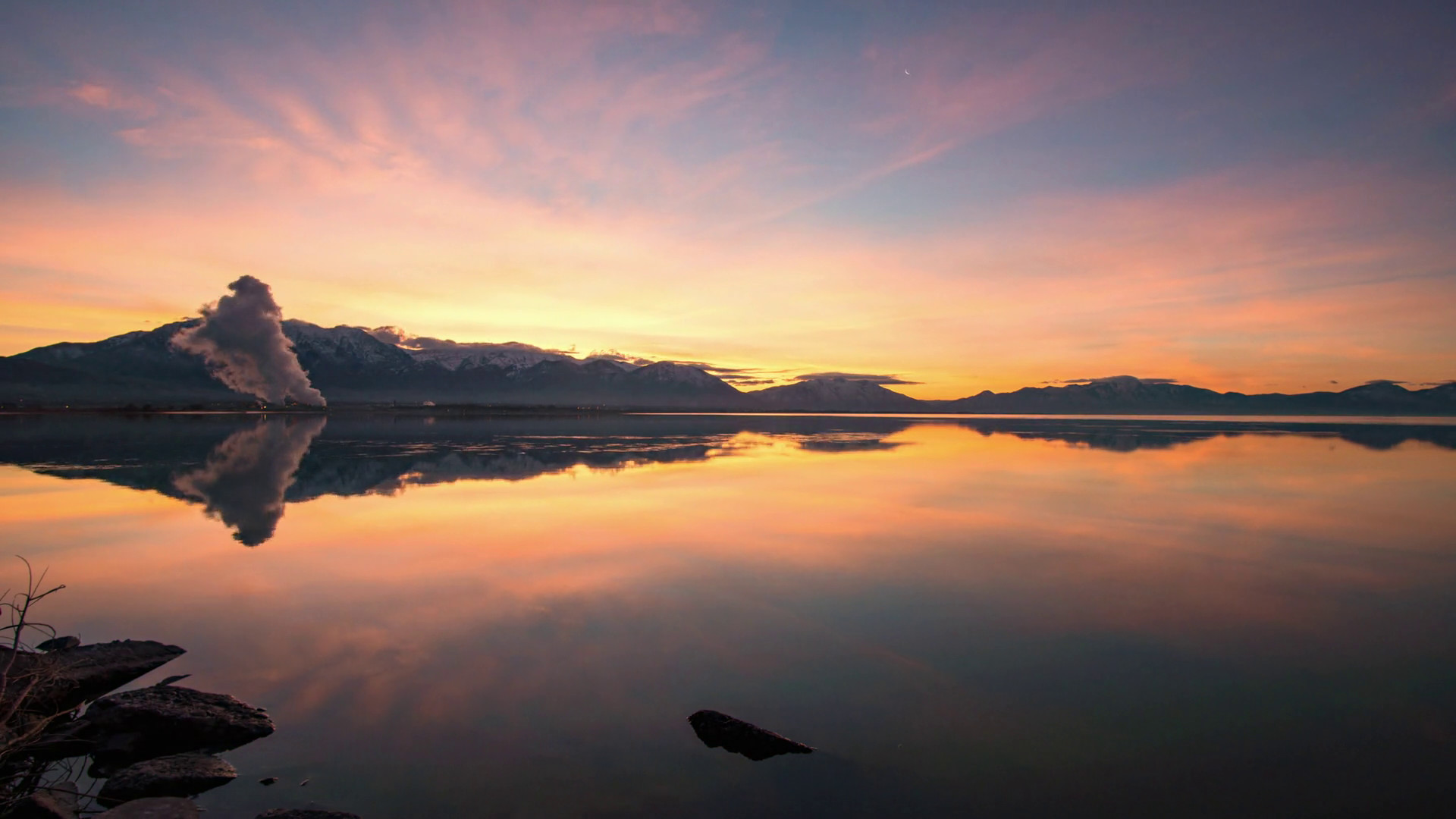 1920x1080 Time lapse of colorful sky reflecting in Utah Lake at sunrise with steam  from power plant in the background. Stock Video Footage - Storyblocks Video