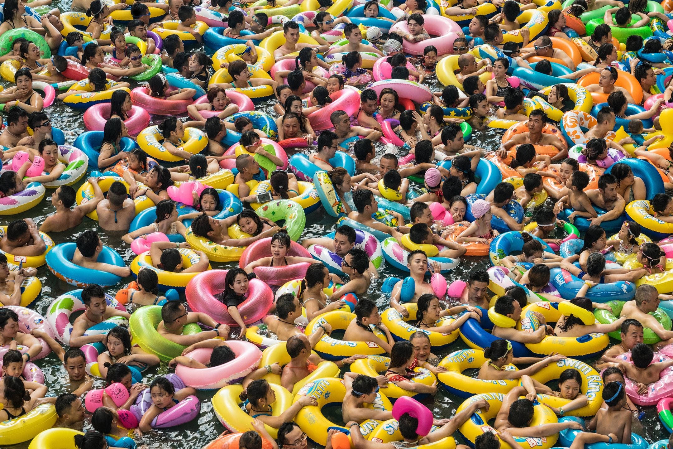 2160x1440 Chinese tourists swim in a lake called the "Dead Sea of China" at a