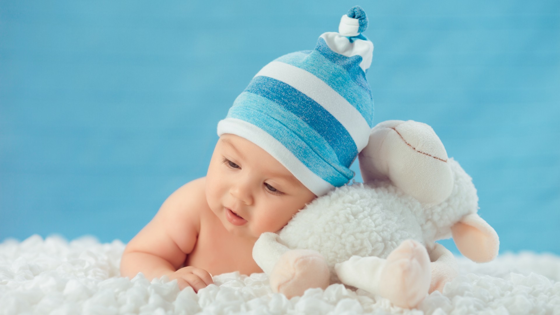 1920x1080 a baby boy lying on clouds with sheep toy cute boy wallpaper full hd free  download