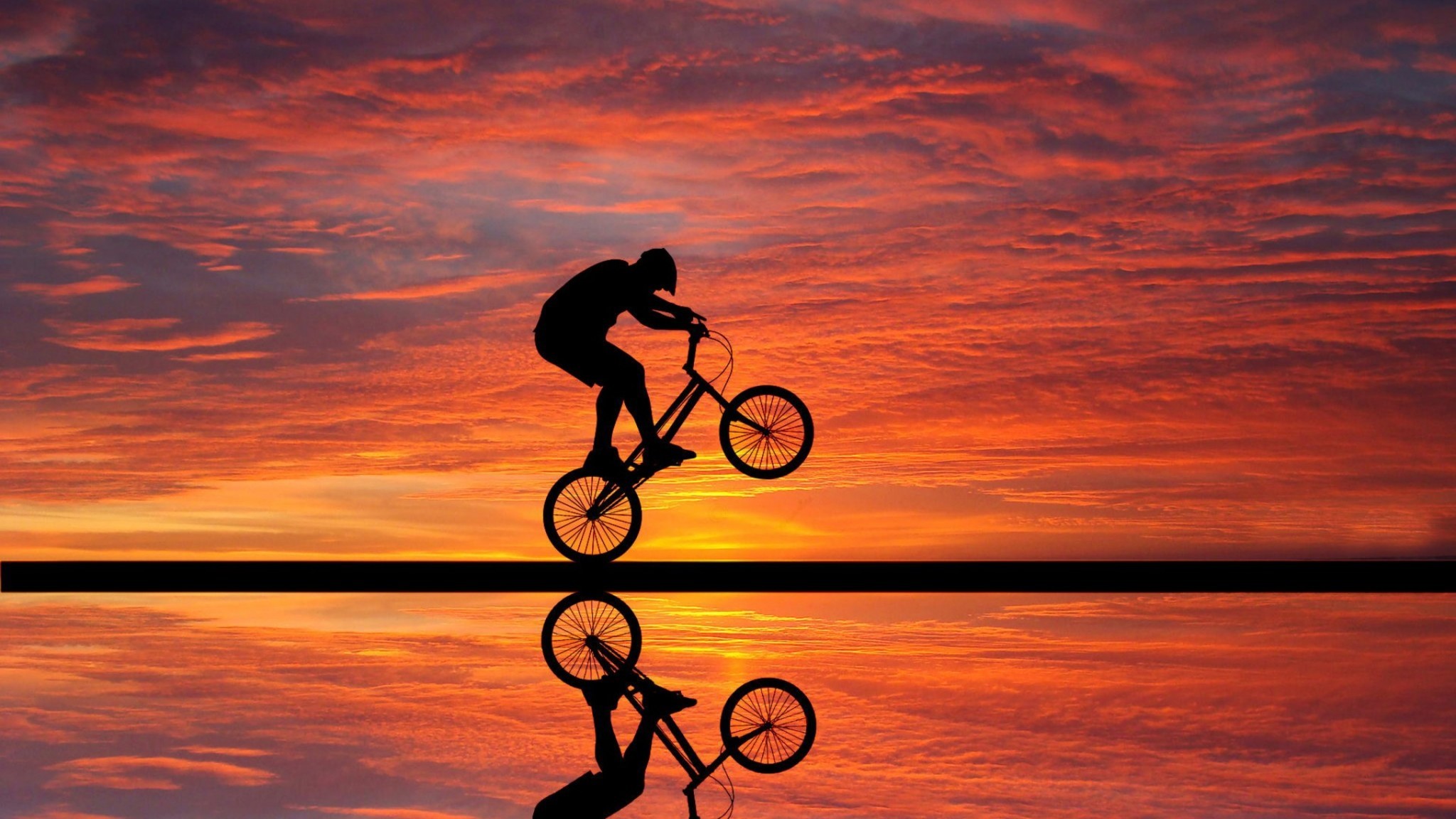 2048x1152 cycling-sunset-qhd.jpg