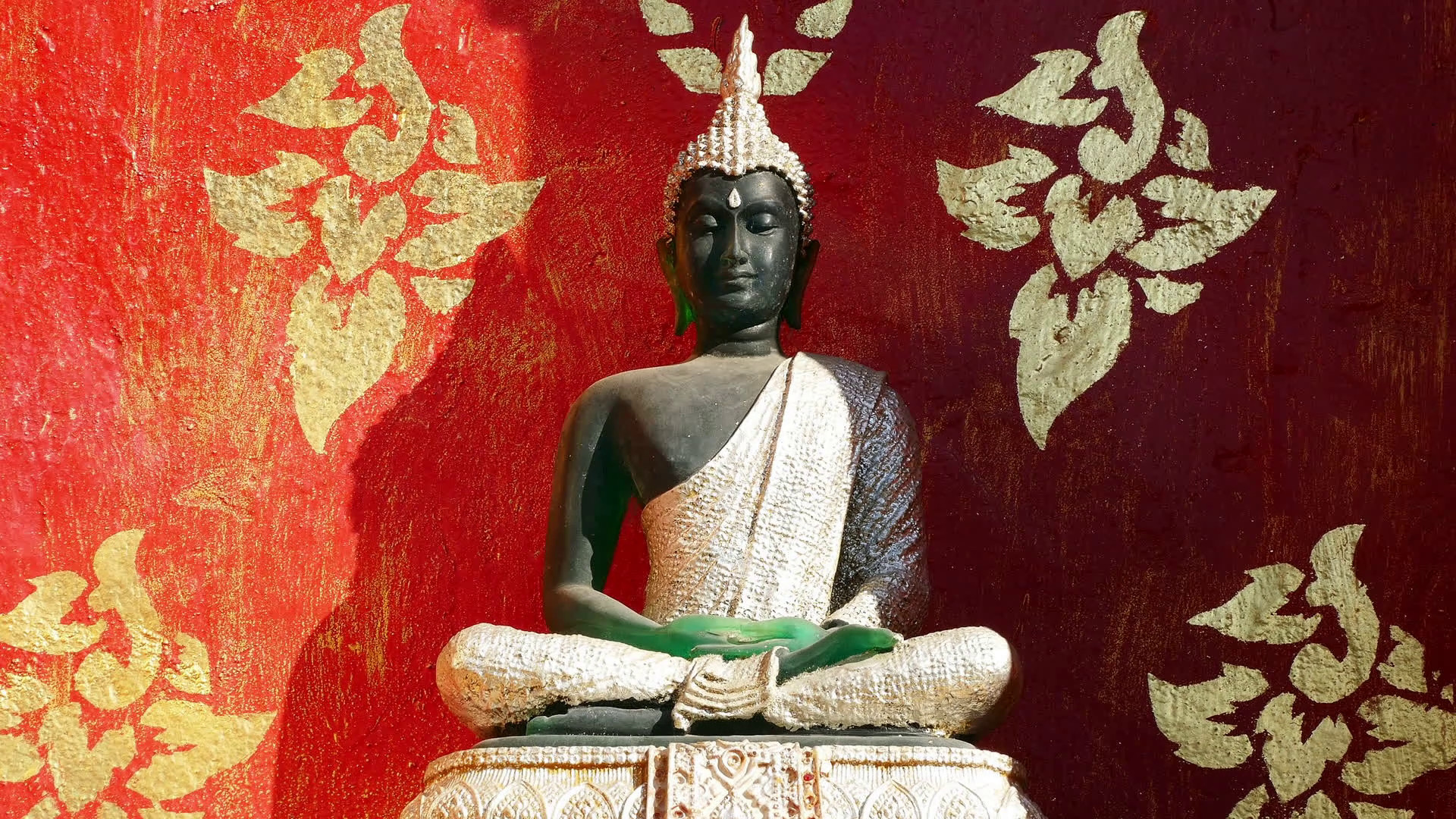 1920x1080 Buddha statue on the background of wall of burgundy color in Buddhist  temple. Stock Video Footage - VideoBlocks