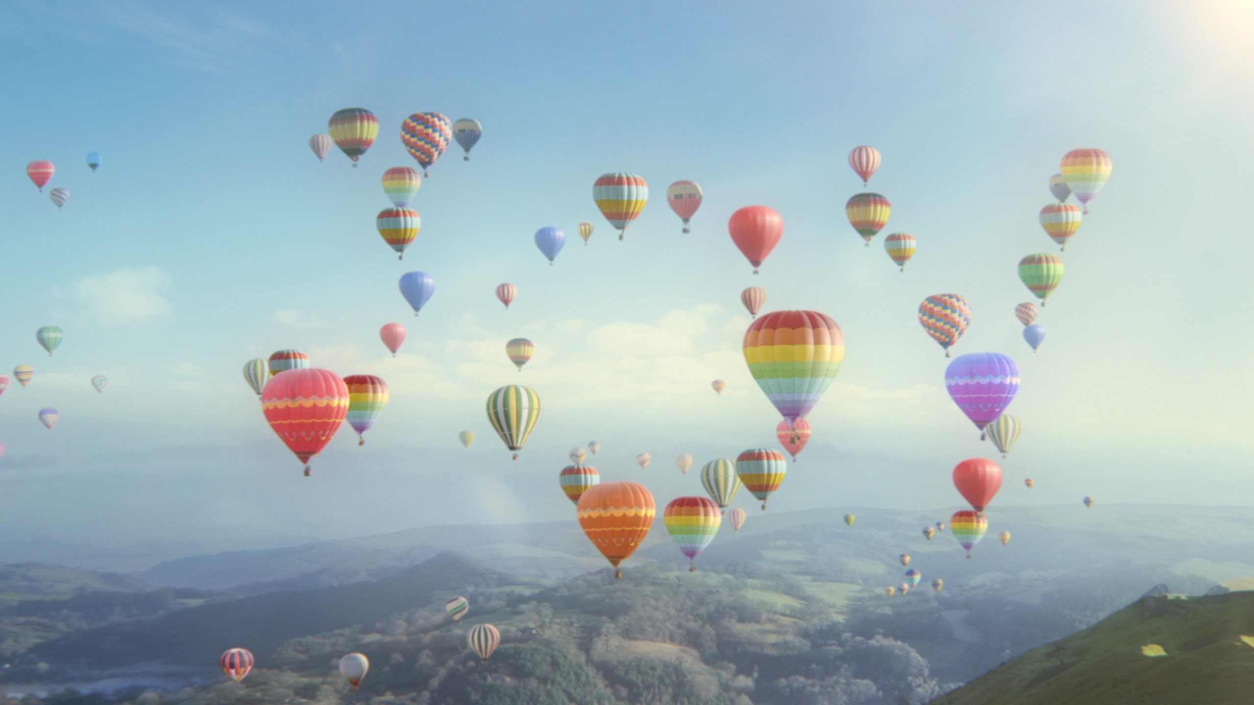 Hot air balloons spell out the word joy