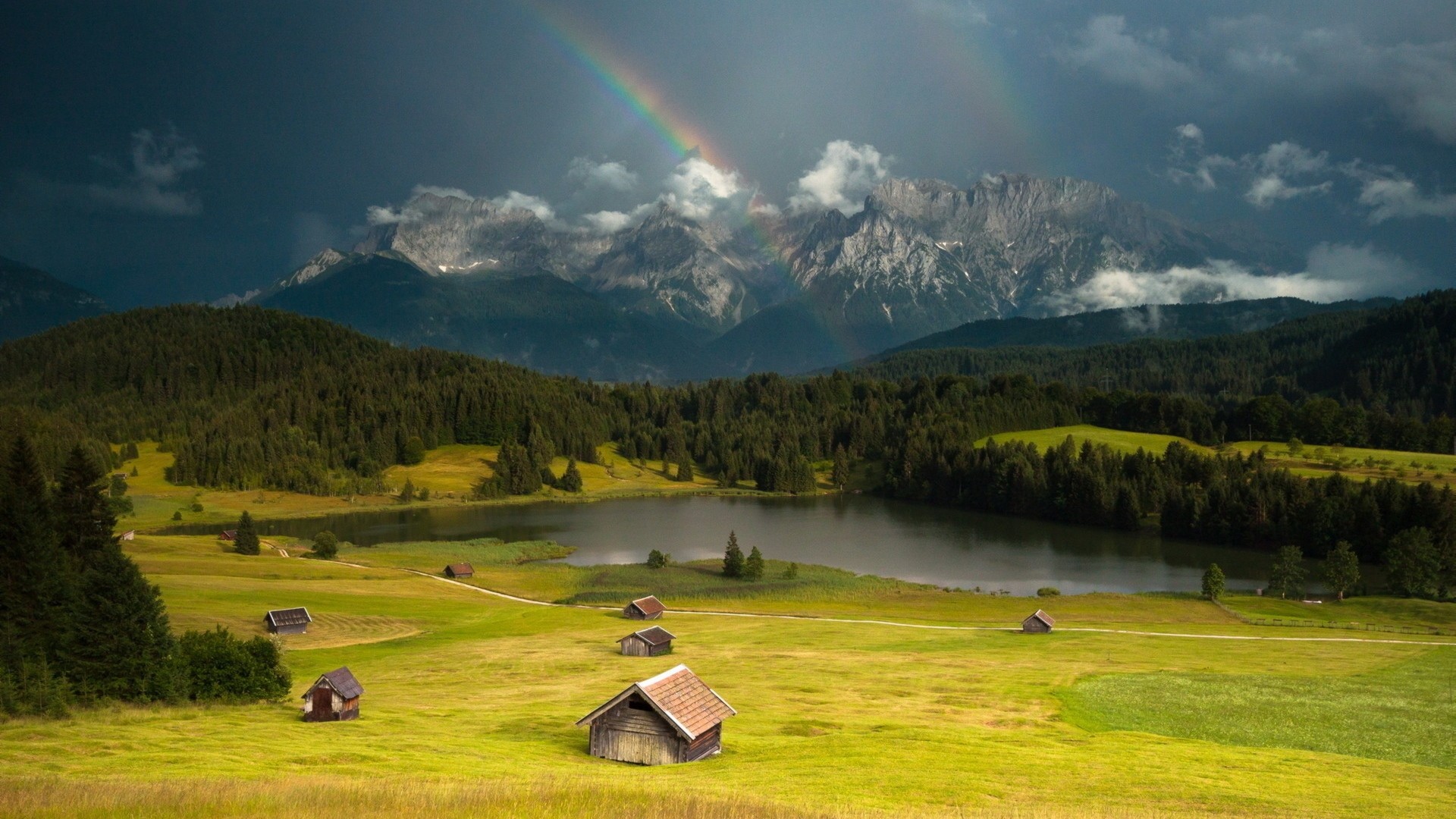 1920x1080  Wallpaper rainbow, lodges, glade, valley, sky, gloomy, cloudy,