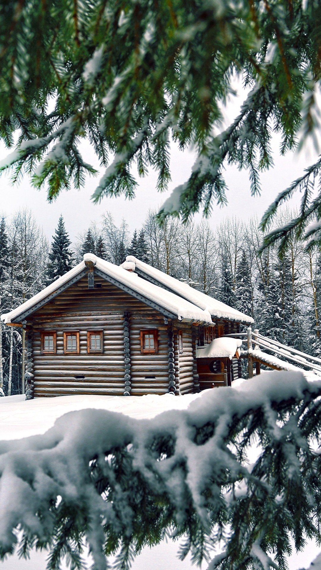 1080x1920 Snowy Christmas log cabin