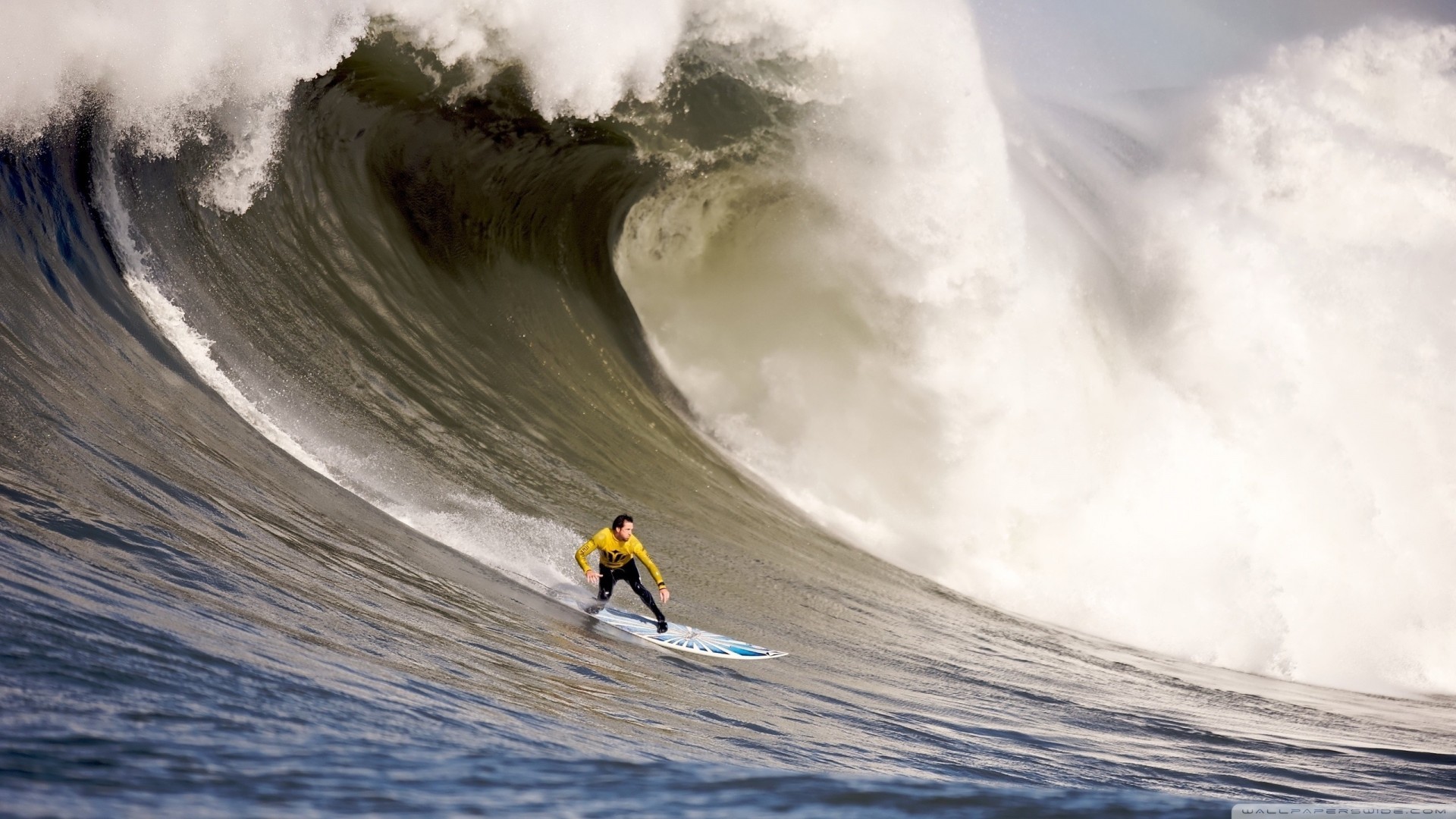 1920x1080 a surfer down a big wave wallpaper