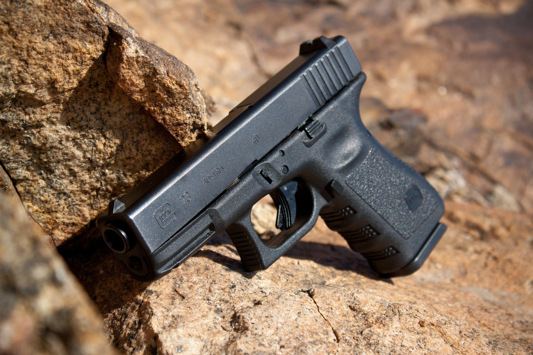 2048x1365 Wallpaper glock 23 semiautomatic pistol, rock, stone wallpapers weapon .
