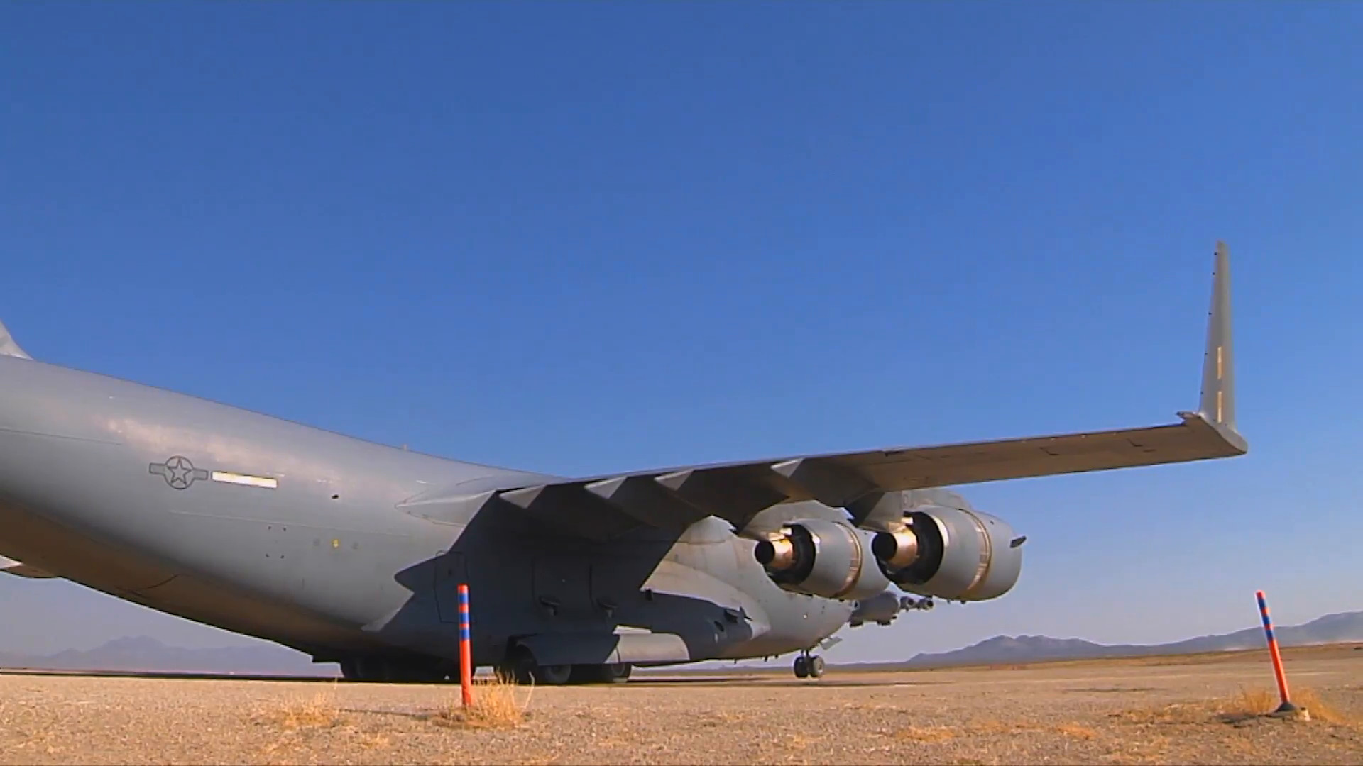 1920x1080 A C-130 cargo plane lands on a dirt runway in the desert. Stock Video  Footage - Storyblocks Video