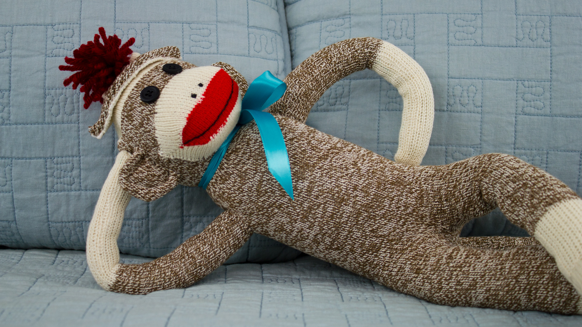 1920x1080 Sock Monkey On Bed