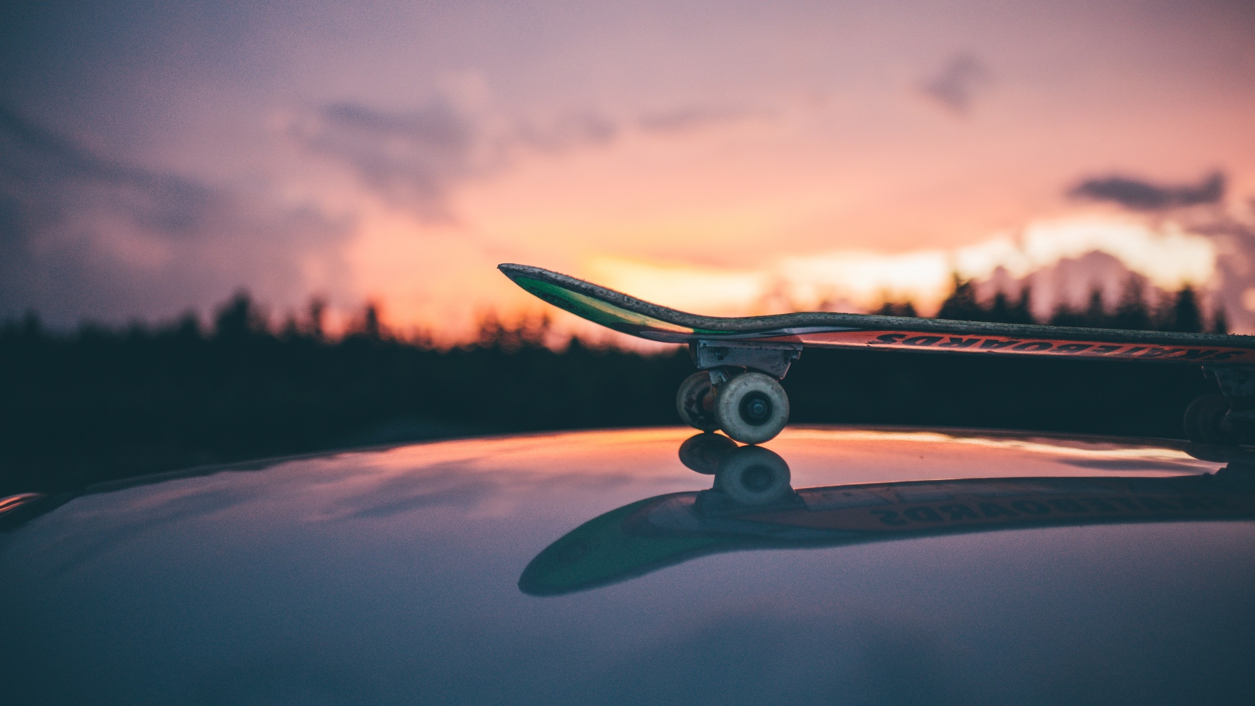2560x1440 Preview wallpaper skateboard, sunset, sky 
