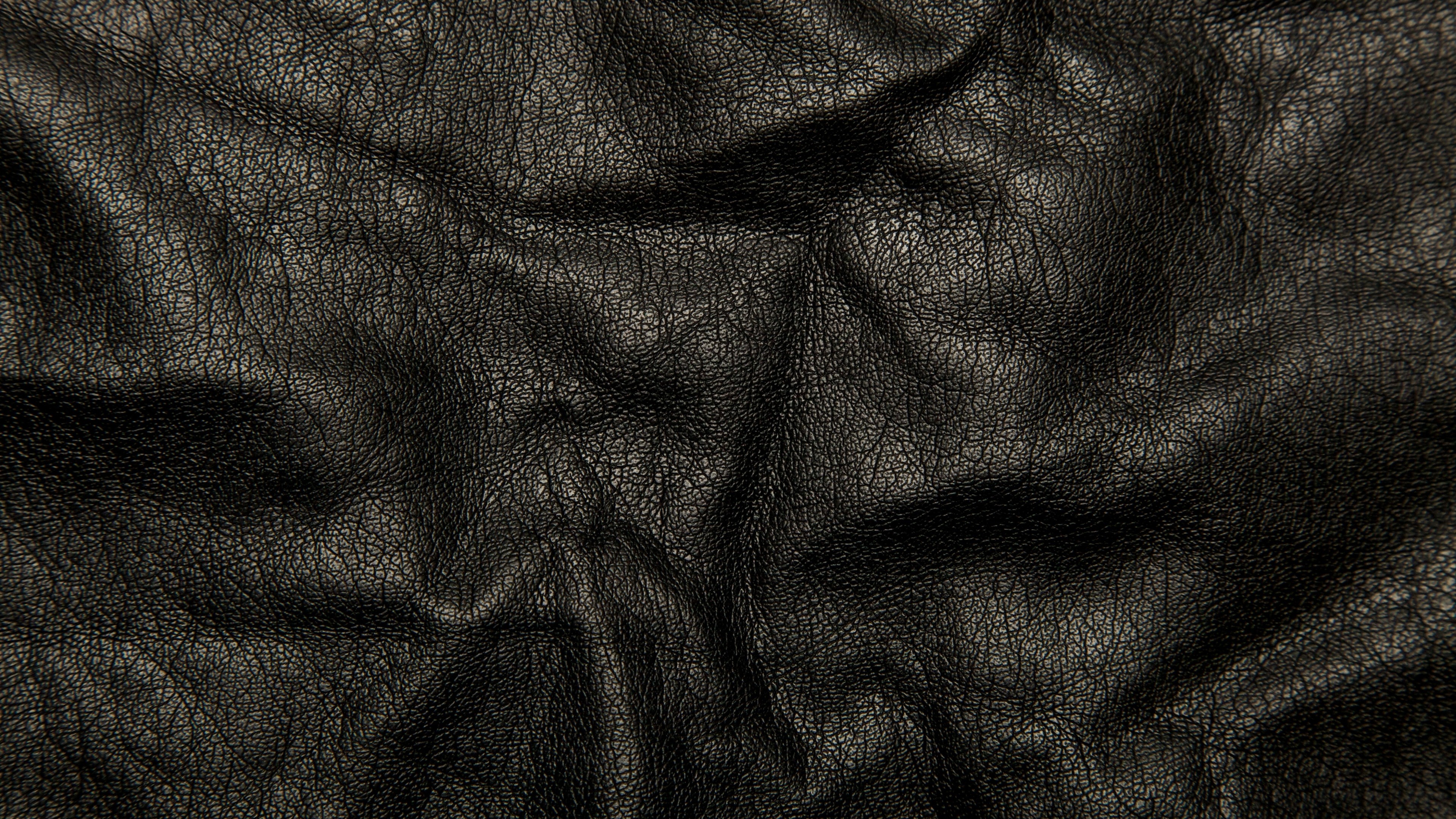3840x2160 Preview wallpaper leather, black, background, texture, wrinkles, cracks  