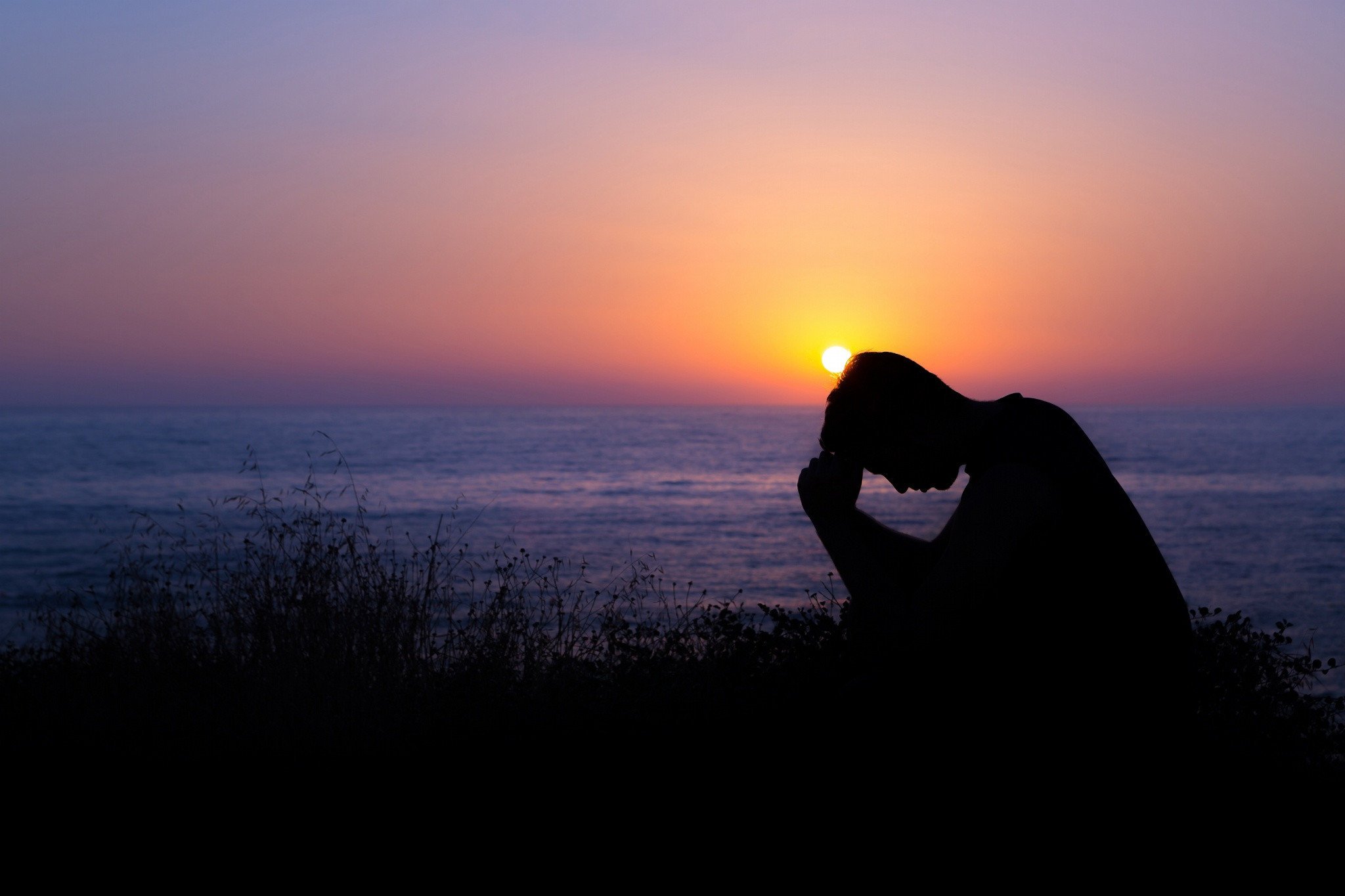 2048x1365 Sad Boy Desktop Backgrounds. Man Praying by the Sea at Sunset