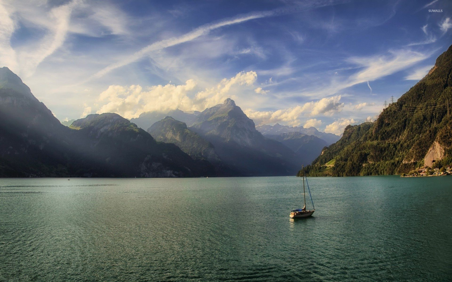 1920x1200 Lonesome small boat on the lake surrounded by the mountains wallpaper   jpg