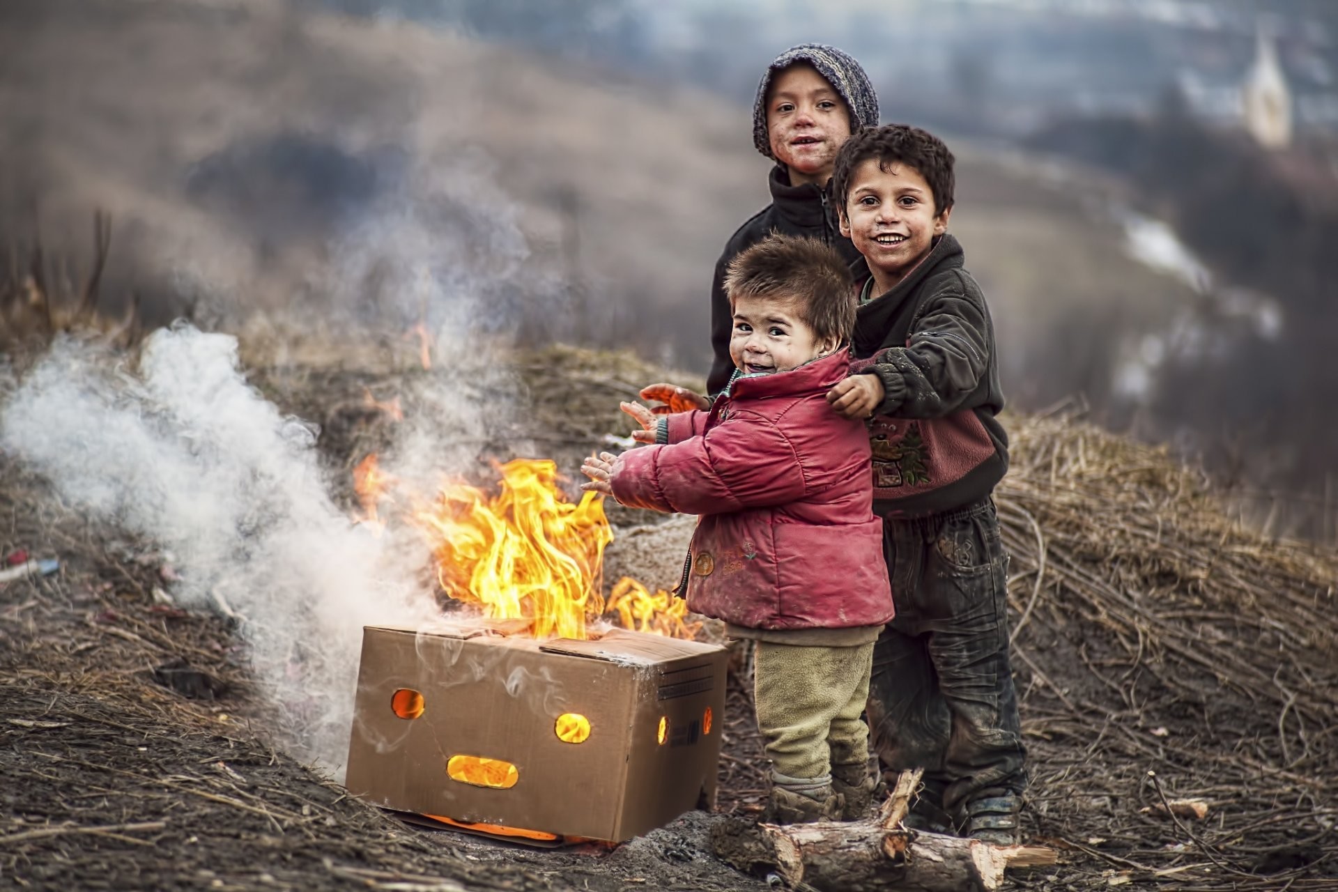 1920x1280 children fire poverty boys grubby smile happiness heat are heated box children  kids flame poor warm