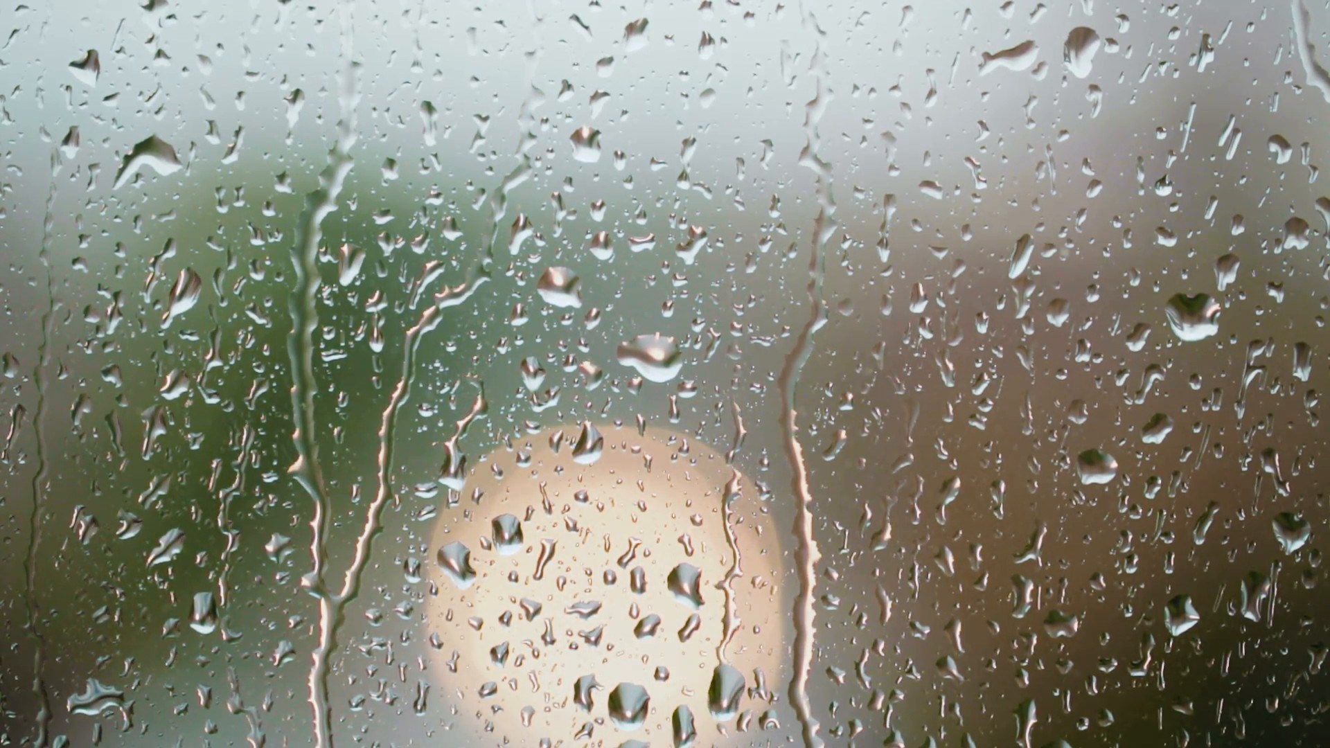 1920x1080 Rain drops on a window with an out of focus vehicle moving in the background.  Stock Video Footage - VideoBlocks