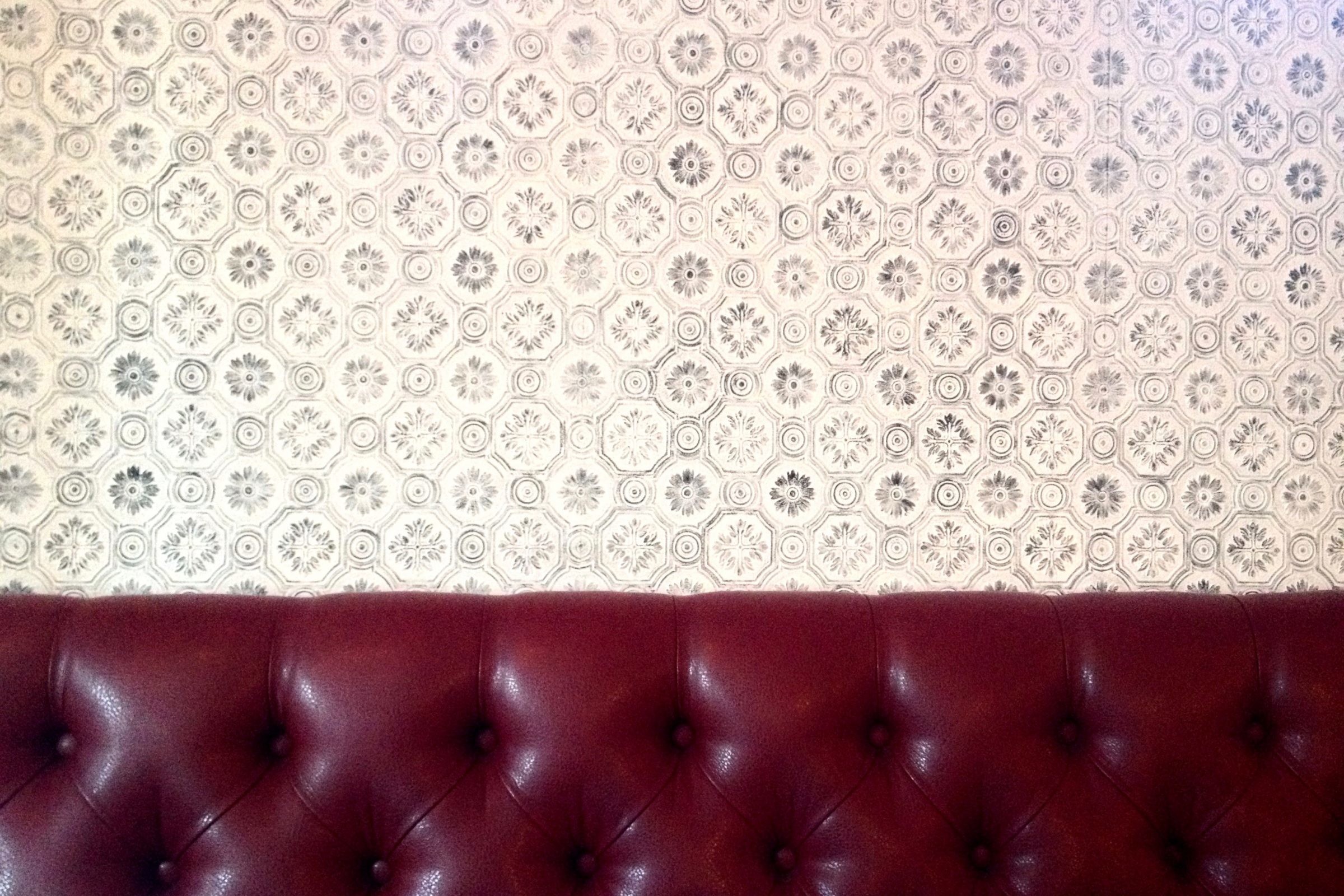 2400x1600 Red Vinyl Seat on Patterned Wallpaper