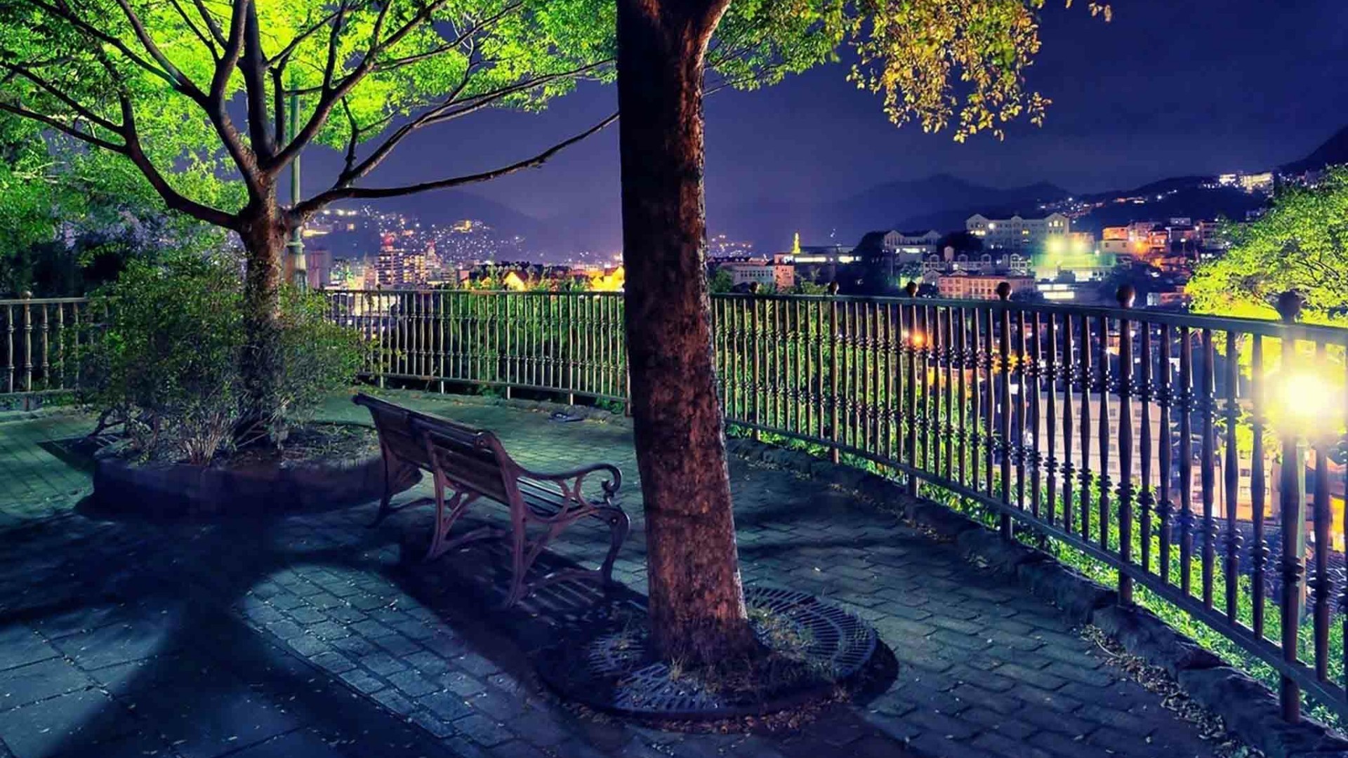 1920x1080 Lone bench over the lights of the city wallpaper