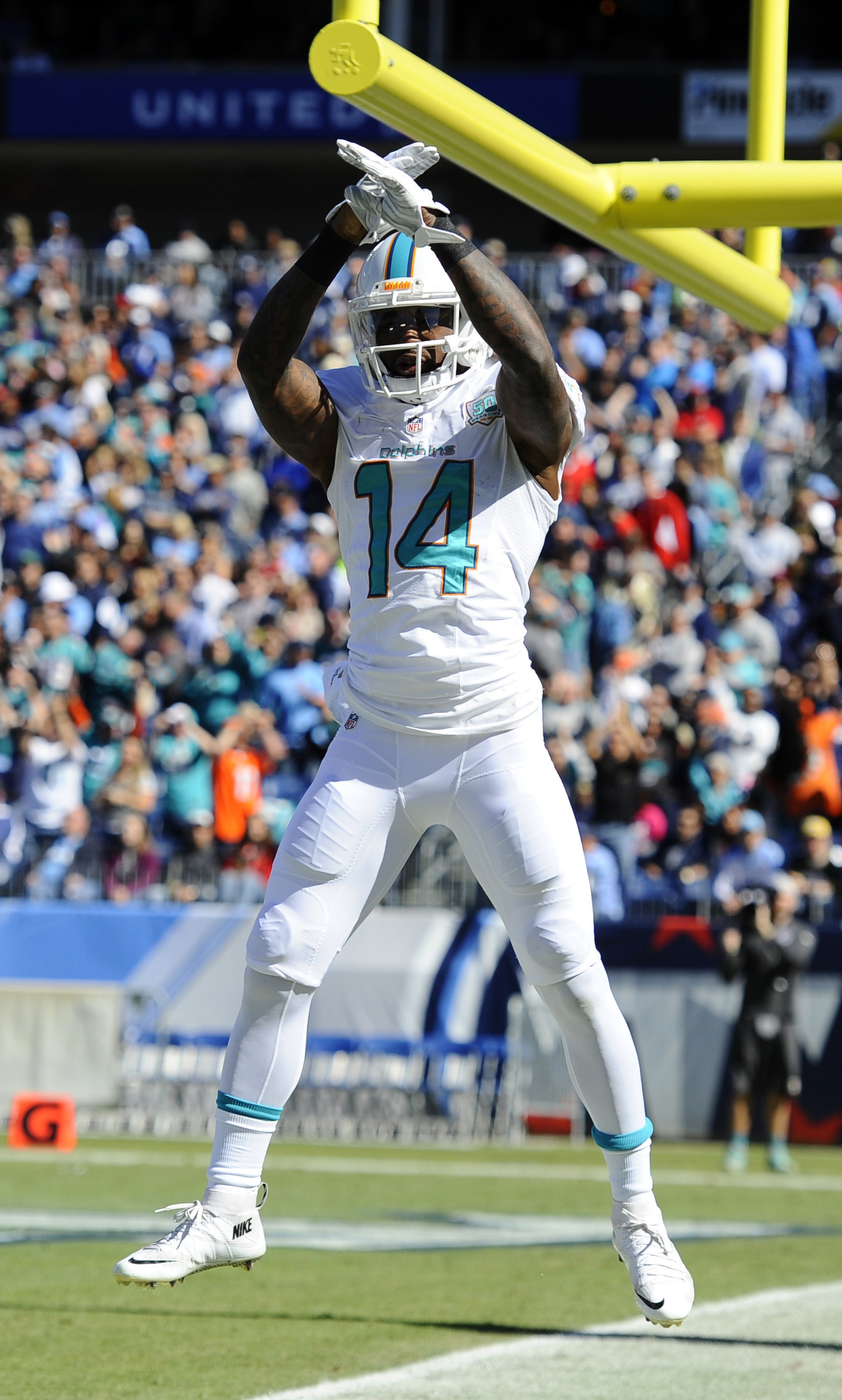 1588x2640 Miami Dolphins receiver Jarvis Landry (14) celebrates after scoring a  touchdown. Landry is