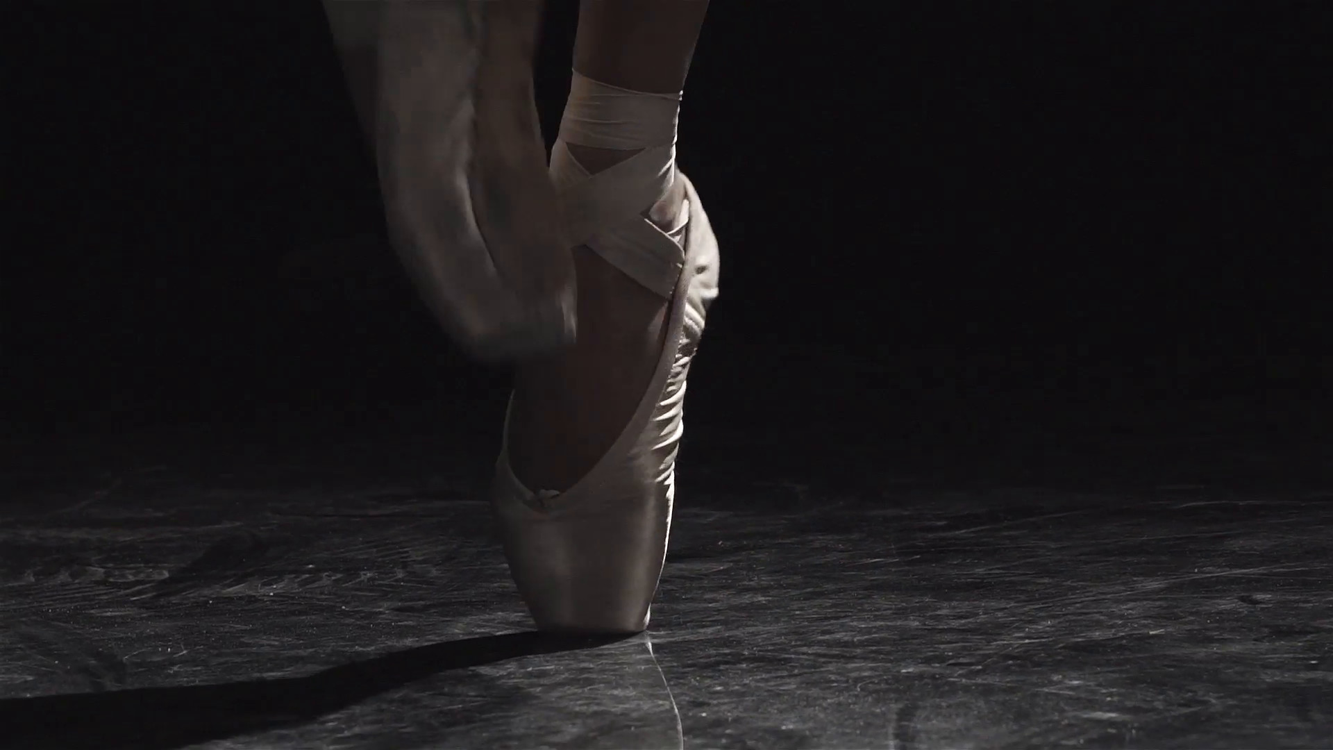 1920x1080 Slow motion close up shot of a ballet dancers feet as she practices in the  dark studio Stock Video Footage - Storyblocks Video