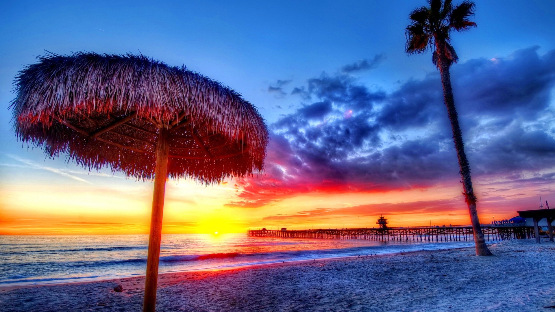 1920x1080  Wallpaper beach, tropics, sea, sand, palm trees, sunset, beautiful